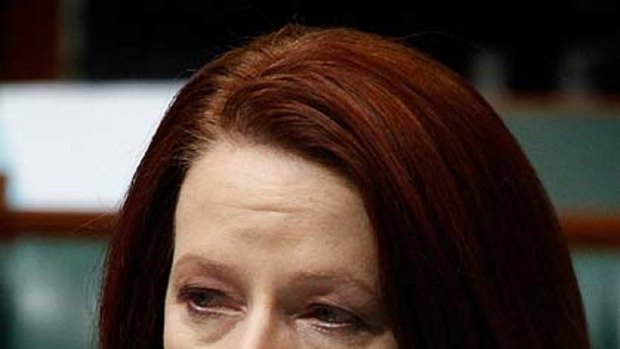 Emotional ... Julia Gillard addresses parliament on the human cost of the floods.