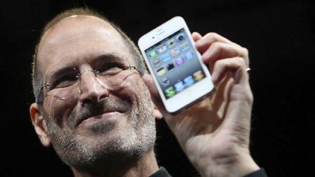 Apple CEO Steve Jobs poses with the new iPhone 4 during the Apple Worldwide Developers Conference in San Francisco.