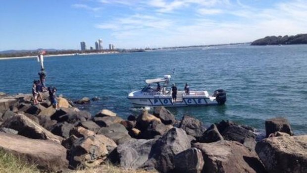Police divers searching for human remains in the Gold Coast Seaway.