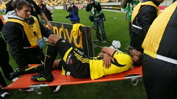 Paul Ifill of the Phoenix is stretchered from the field on Sunday.