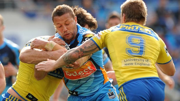 Scott Prince of the Titans is tackled during the round 24 NRL match between the Gold Coast Titans and the Parramatta Eels at Skilled Park.