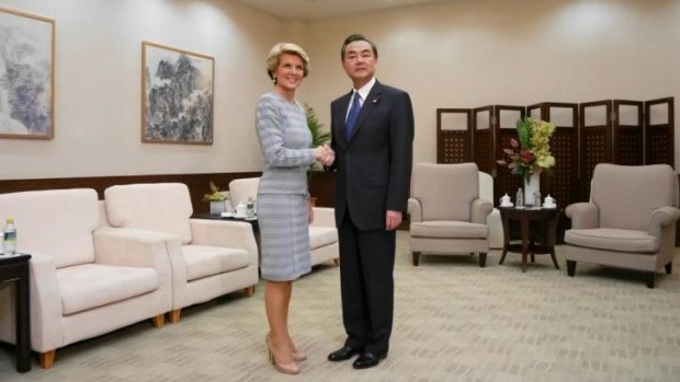 On friendlier terms: Australia's Foreign Minister Julie Bishop and her Chinese counterpart Wang Yi in Sanya, Hainan Province.