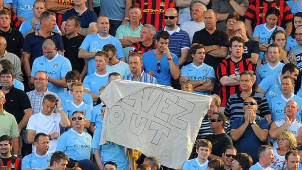 Manchester City fans hold a banner reading "Tevez out" during a match against Blackburn Rovers in October last year.