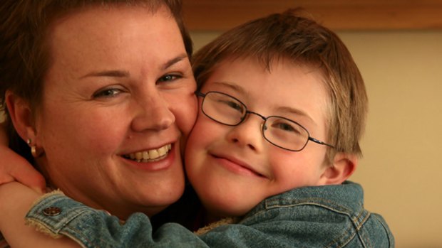 Future fears: Catherine McAlpine with one of her three sons, Julian, who has Down syndrome.
