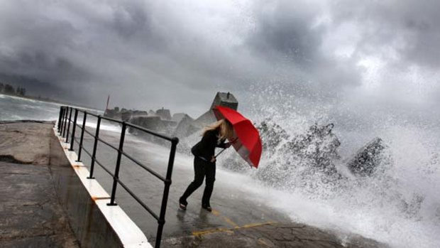 Making a splash ... Emilie Lovatt battles the elements at Wollongong Harbour.