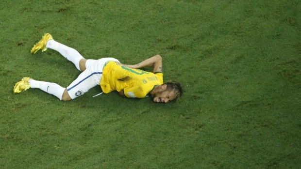 Back breaker ... Brazil's forward Neymar reacts on the ground after being injured following a foul by Colombia's defender Juan Camilo Zuniga.