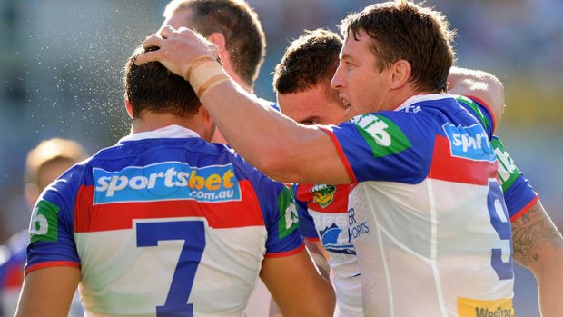 Kurt Gidley of the the Knights celebrates with teammates.