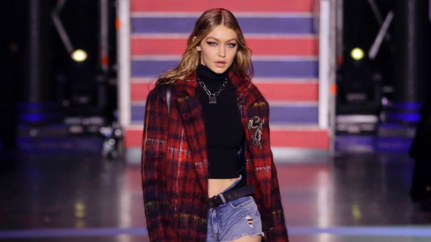 Model Gigi Hadid wears a creation by designer Tommy Hilfiger at the spring/summer 2018 runway show in London.