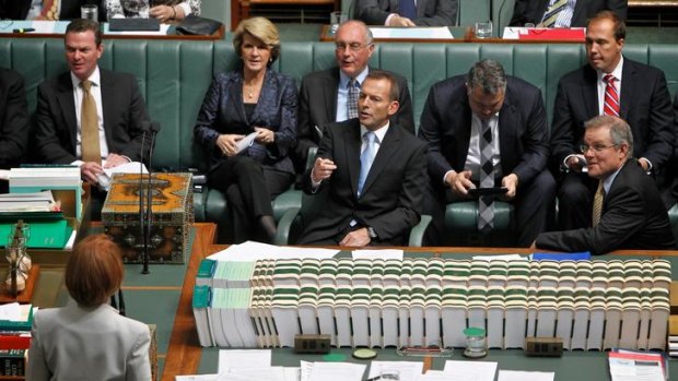Wall of opposition: Prime Minister Julia Gillard and Opposition Leader Tony Abbott clash during question time on Tuesday.