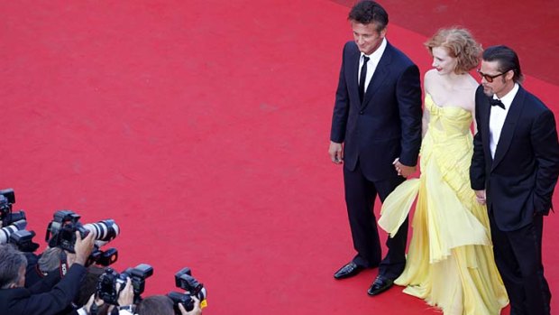 Striking a pose ... (from right to left) Brad Pitt, Jessica Chastain and Sean Penn.