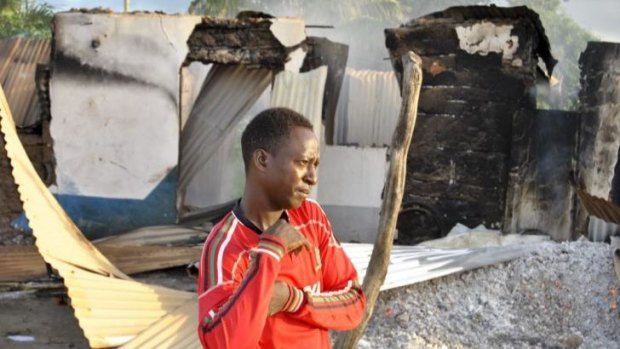 The rubble left behind: A Mpeketoni man surveys the damage to his town. 