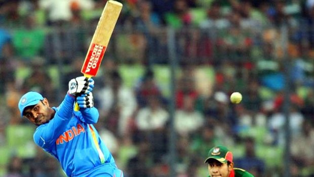 Blast off . . . Virender Sehwag hits a six on his way to equalling Kapil Dev's record of 175 for the highest score by an Indian at the World CUp.