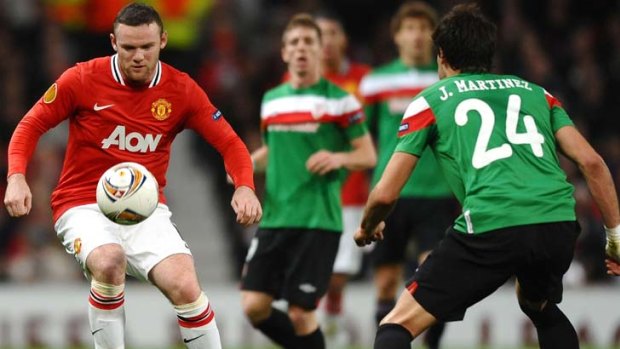 On the ball &#8230; United star Wayne Rooney against Athletic Bilbao.
