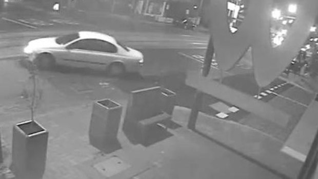 A car filmed leaving the scene of a shooting at a Brunswick East pizza store.
