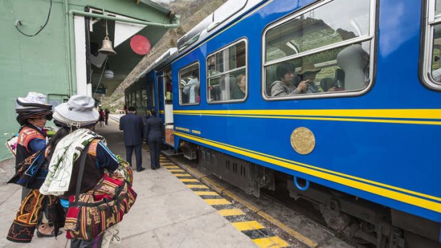 An Inca souvenir vendor at Ollanta train station in Ollantaytambo.