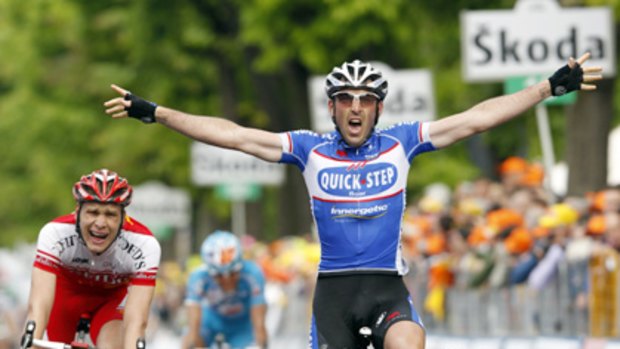 Frenchman Jerome Pineau crosses the finish line after stage five.