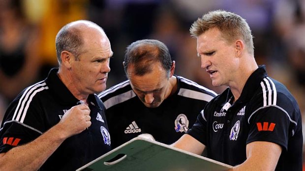 Back to the drawing board: Nathan Buckley (right) and assistant Rodney Eade discuss tactics during the loss to Hawthorn.