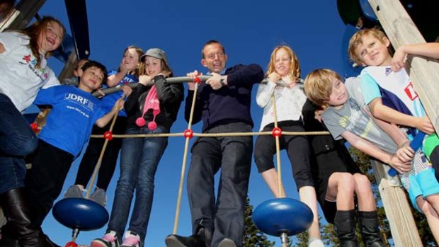 High hopes ... the children of Manly ride the ropes with Liberal leader Tony Abbott.