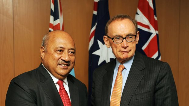 Fiji's Foreign Minister Ratu Inoke Kubuabola, left, shakes hands with Australia's Foreign Minister Bob Carr.