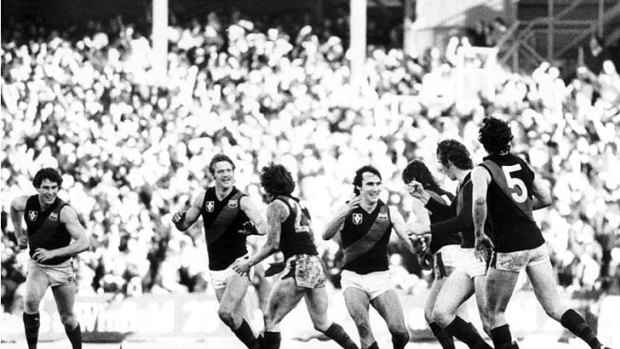Paul Van Der Haar, Grant Fowler, Glen Hawker, Merv Neagle and Terry Daniher (no. 5), congratulate Neale Daniher (second from right) after his match-winning gaol against Carlton in 1981.