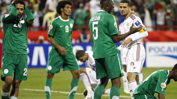 Saudi Arabia players react after a missed chance against Jordan during their Asian Cup match in Doha.