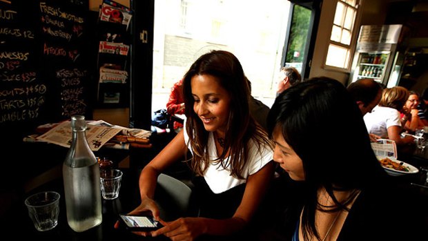 "It's made it easier to connect and meet up with friends when out" ... Anika Magee, who uses the new phone application Foursquare, in a Darlinghurst cafe.