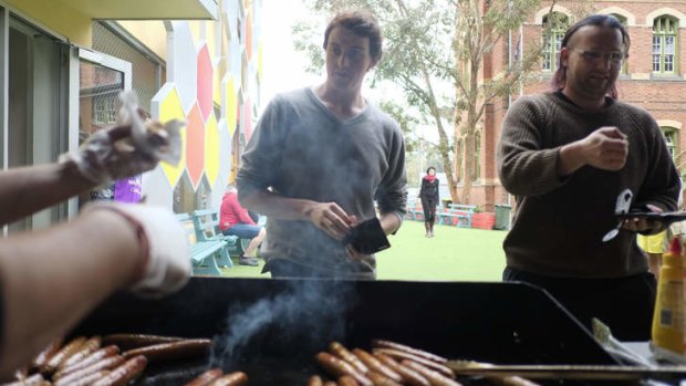 Voters enjoy sausages at Carlton Gardens Primary School.