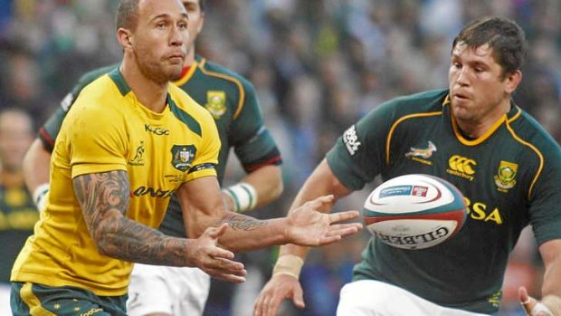 Quade Cooper gets a pass away for the Wallabies.