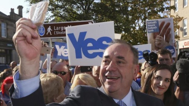 Scotland's First Minister Alex Salmond takes a "selfie" photograph as he campaigns for the Yes vote through Largs, Ayrshire.
