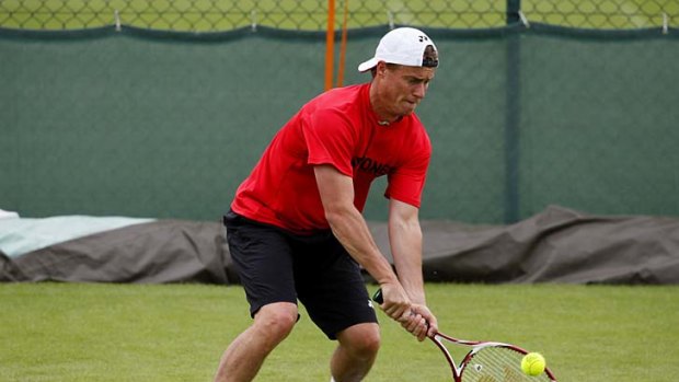 Lleyton Hewitt manages with a troublesome foot.