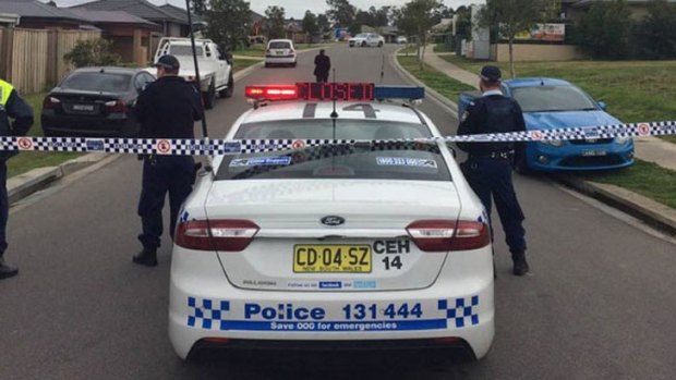 Police have taped off Redgum Circuit in Aberglasslyn following the discovery of a girl's body.
