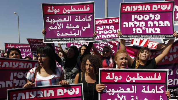 Palestinians, Israelis and foreign women activists attend a rally to show solidarity for a Palestinian state with full UN membership.