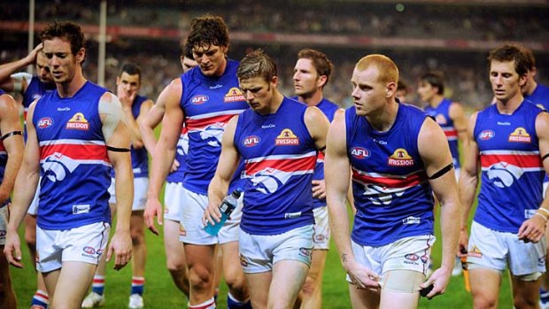 The Western Bulldogs leave the field after losing to Collingwood.