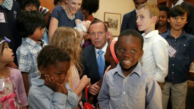 Prime Minister Tony Abbott meets with families during a morning tea ahead of Adoption Awareness Week.