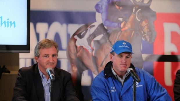 Colour run: John O'Shea (right) dons the Godolphin blue at last month's launch.  He had his first Sydney winner in the new gear on Wednesday.