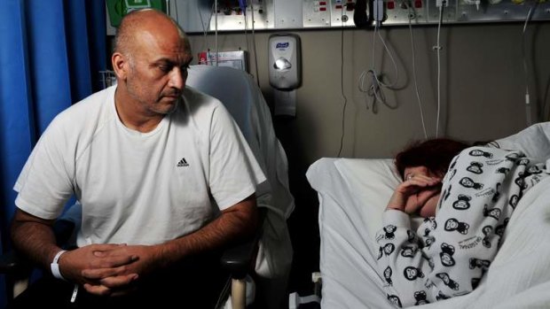 Salmonella victims Marcelo Solar sits with his wife in Calvary Hospital.