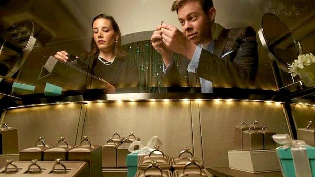 The ring's the thing: Saleswoman Coralle Baernhoft, from Tiffany's in Collins Street, Melbourne, shows a potential customer a selection of rings.