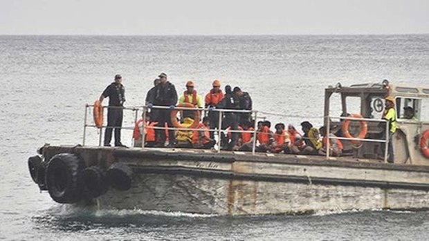 A barge carrying rescued suspected asylum seekers nears Christmas Island on June 22, 2012.