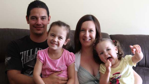 Devotion ... a pregnant Michelle Lyons at home with her husband Joshua Corbet and their daughters Madison, 2, and Isabella, 4.