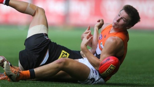 Toby Greene of the GWS Giants drops a chest mark against St Kilda in March.
