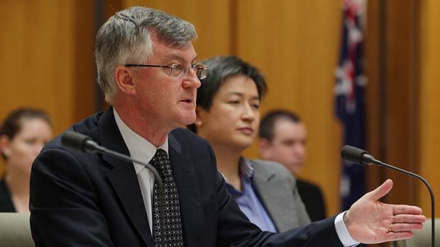 Two hats: Martin Parkinson with Finance Minister Penny Wong.