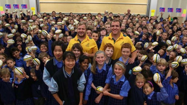 From the engine room to the classroom ... Benn Robinson and Ben Alexander visit Dural Public School, Alexander's alma mater,yesterday.