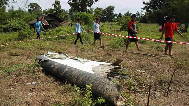Bad weather blamed: People arrive at the crash site of the ATR-72 turboprop plane.