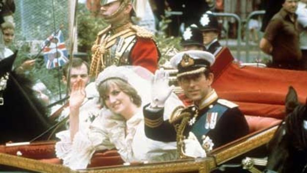 Royal carriage... The Princess and Prince of Wales wave on their wedding day, July 29, 198. Photo: AP