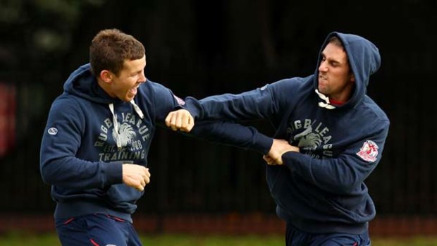 Todd Carney and Mitchell Pearce spar during training.