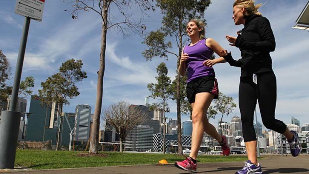 Setting the pace: Jessica McKenzie training outdoors for the half marathon with personal trainer Charlie Towey of Verve 4Life at Pyrmont.