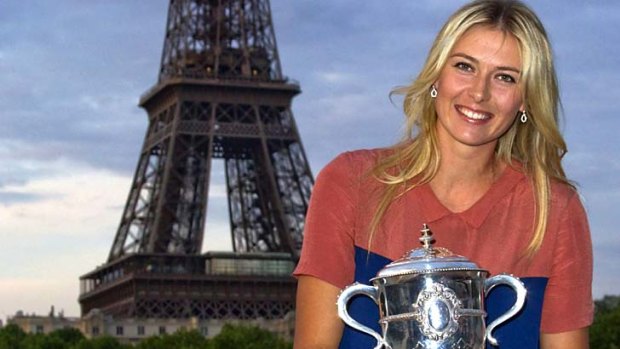 Sharapova with her trophy near the Eiffel Tower.