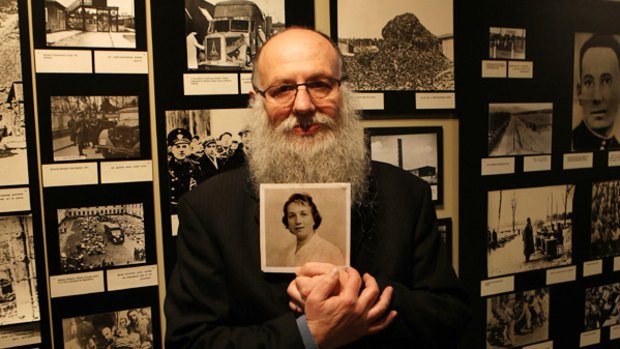 Jewish Holocaust Centre director Bernard Korbman with a picture of his mother, who was forced to work with Josef Mengele