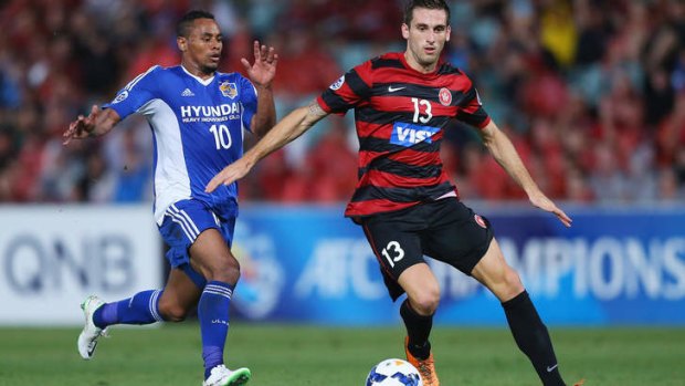 Tough initiation: Rafinha of Ulsan Hyandai competes with Western Sydney's Matthew Spiranovic during the Asian Champions League match at Parramatta.