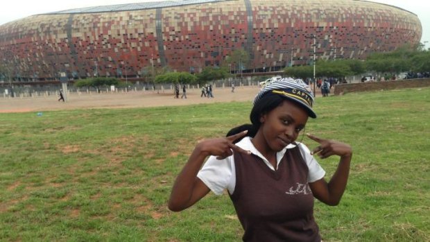 Gift of employment ... Nondumiso Ndzamela, 23, is one of thousands of South Africans who worked at Nelson Mandela's memorial at Soweto's FNB Stadium.